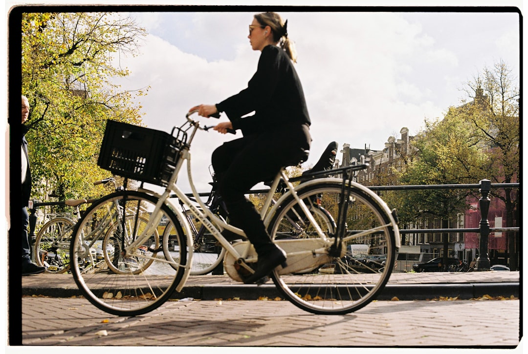 Woman riding a bicycle with a basket